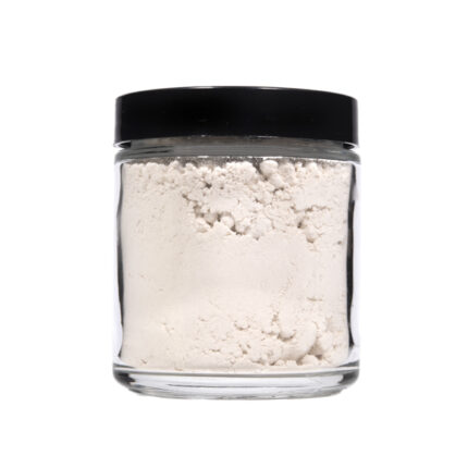 Front view of a sealed clear jar with a black lid containing Vivimu’s white CBGa isolate powder, a pure hemp-derived bulk cannabinoid extract