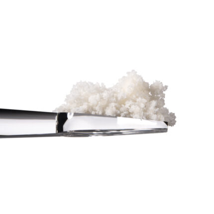 Vivimu Delta 8 Water Soluble powder — close-up of fine, fluffy hemp-derived Delta 8 powder on a silver metal scoop, ideal for mixing into beverages or tinctures.